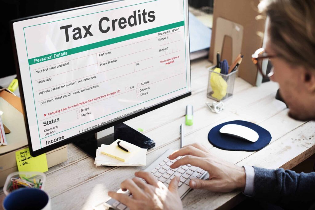 A friendly individual uses a desktop computer to complete a tax credits application form, with sections for personal and income information clearly visible. As Northern California’s trusted home service provider, Bell Brothers is proud to offer our No Surprise Guarantee, delivering transparent, upfront pricing and service from background-checked technicians—earning us a strong reputation in communities throughout the region.