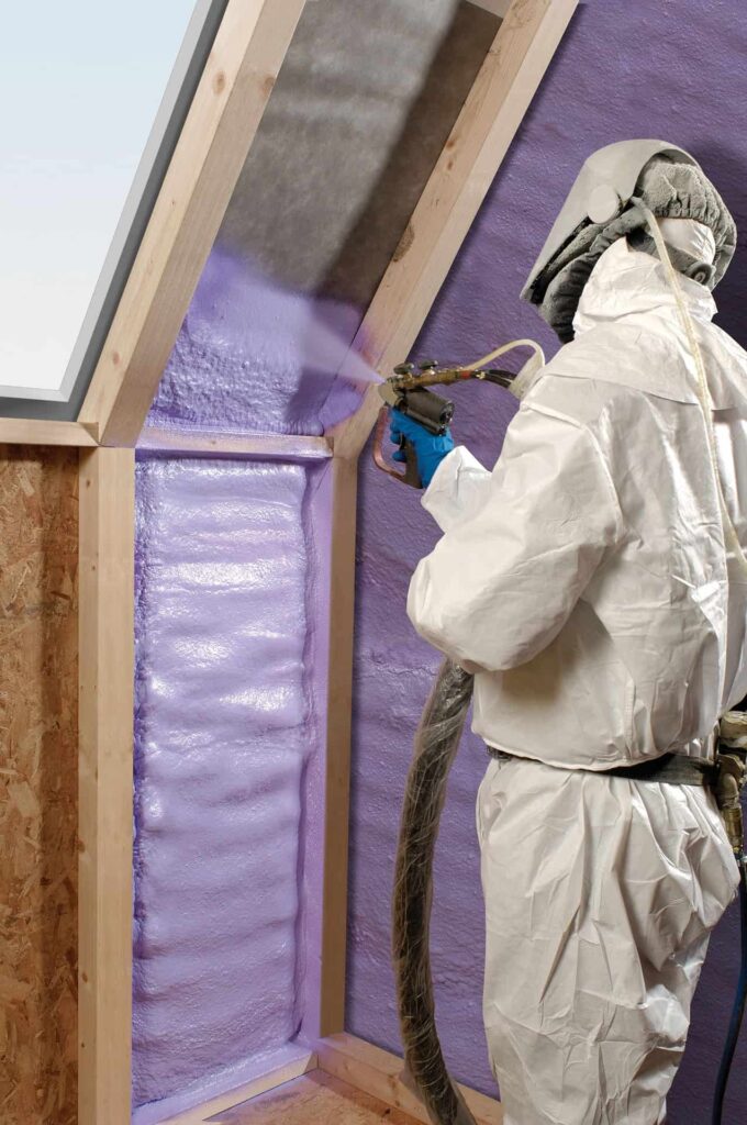 A Bell Brothers technician—background-checked and fully equipped in protective gear—expertly applies spray foam insulation to an attic under construction. With Bell Brothers’ trusted service, upfront pricing, and No Surprise Guarantee, homeowners throughout Northern California can count on a comfortable home and complete peace of mind.