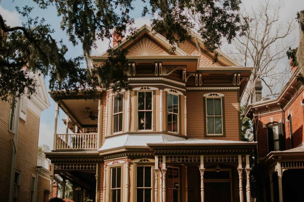 A beautiful two-story Victorian-style home with ornate trim, large bay windows, and a welcoming covered porch stands surrounded by trees and neighboring homes. Trust Bell Brothers’ background-checked technicians for reliable service, upfront pricing, and our No Surprise Guarantee—proudly serving Northern California communities with an outstanding reputation you can count on.
