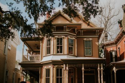 A beautiful Victorian-style two-story home with elegant woodwork, large bay windows, and a welcoming covered porch sits among trees and neighboring houses. With Bell Brothers’ trusted service across Northern California communities, you can count on our No Surprise Guarantee, background-checked technicians, and upfront pricing—delivering comfort to homes just like yours.