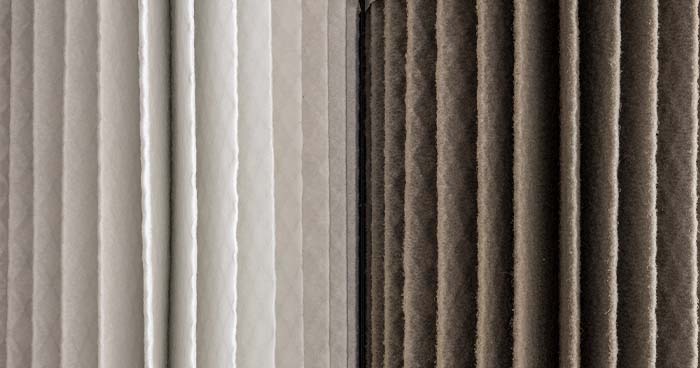Image: a clean and dirty air filter side by side so you can see the difference. If your HVAC is not cooling, a dirty air filter could be the culprit.