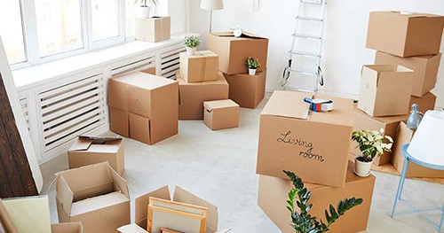 Image: cardboard boxes full of stuff for storage.